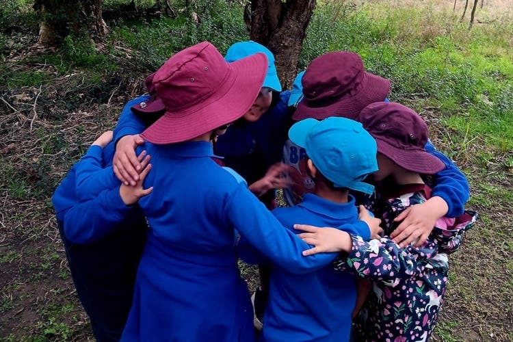 Students completing a team challenge