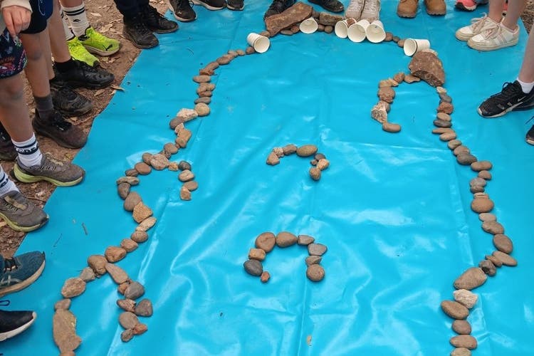 A model of an Aboriginal fish trap made of small stones