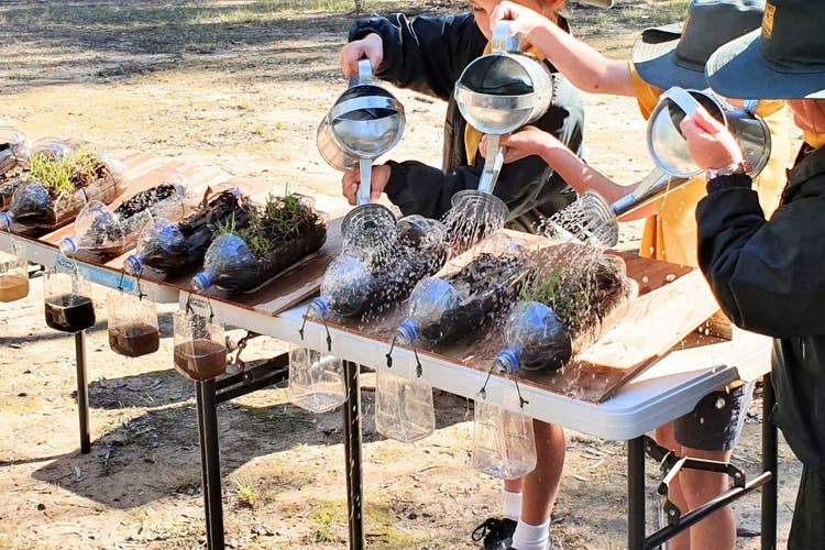 Students conducting an erosion experiment