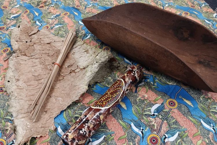Various Aboriginal tools on a blanket