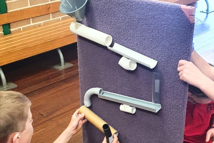 Students constructing a marble run